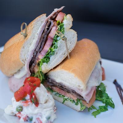 Plate with Lomito Especial sandwich.