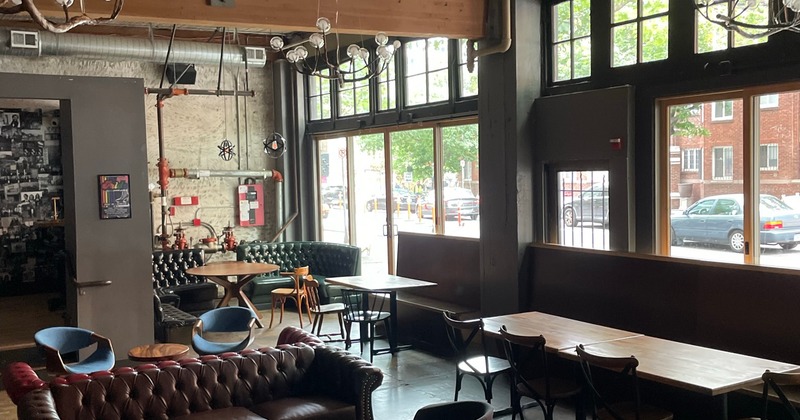 Cozy, industrial-style interior seating area with high ceiling
