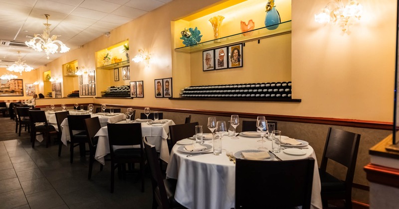 Interior, dining area, tables for four and five people, ready for guests, tile flooring