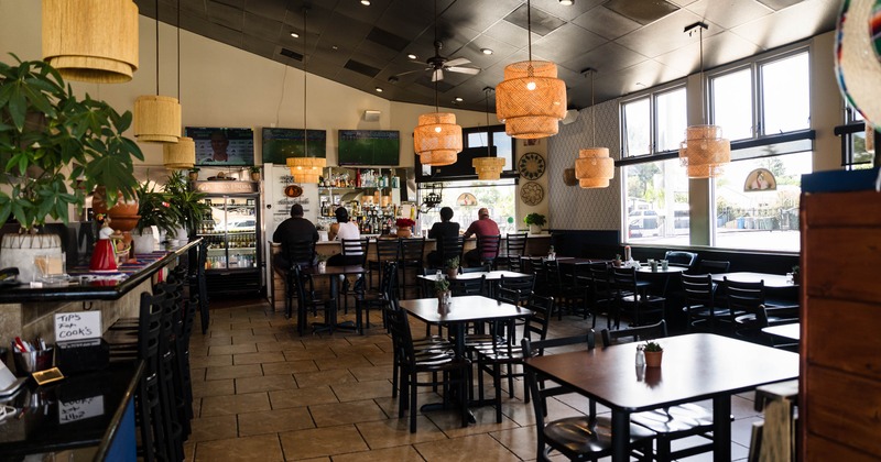 Interior, tables and chairs in dining area