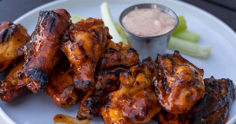 Chipotle wings served with sauce dip