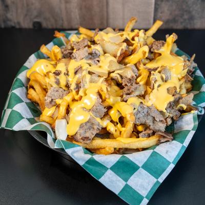A basket of cheesesteak fries.