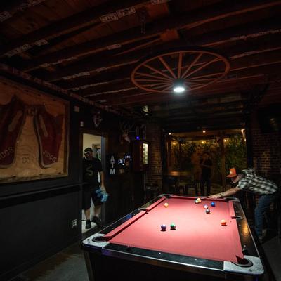 A person playing pool.