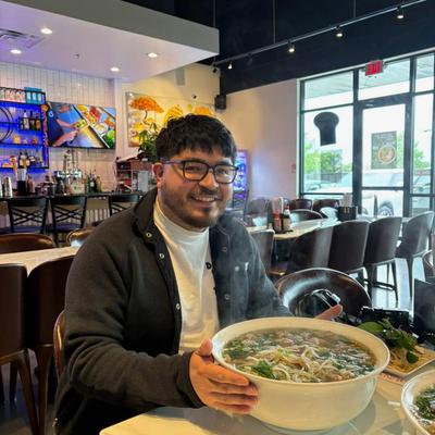 Customer holding a large soup bowl.