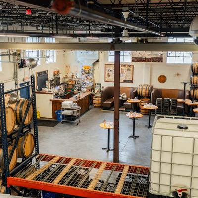 Distillery interior, beverage tanks, barrels.