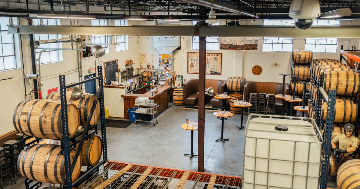 A spacious room filled with barrels and tables