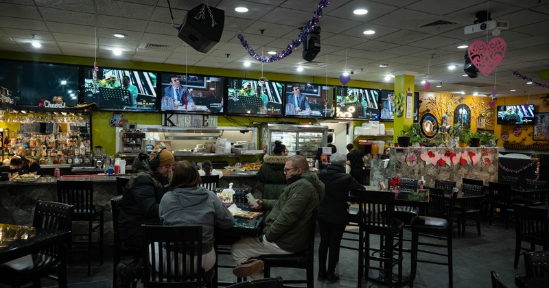 Interior, tables and chairs, guests sitting and chatting