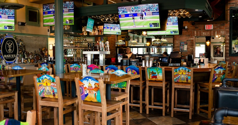 Interior, bar area, tables, stools, bar behind