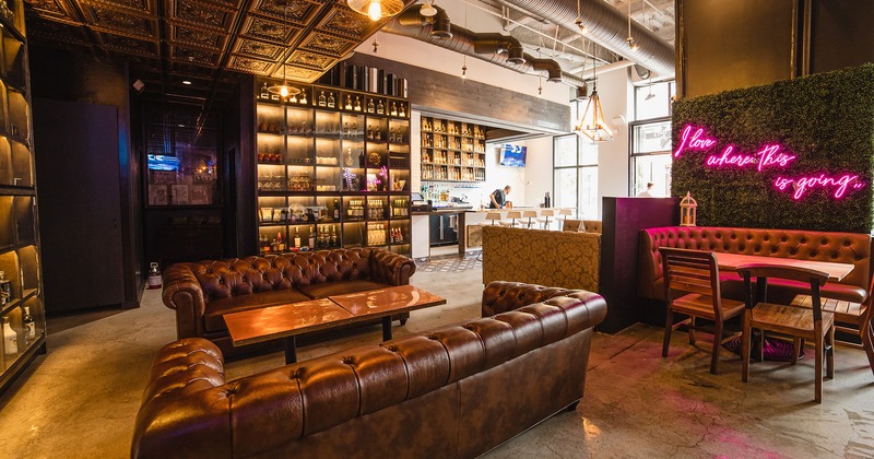 Interior, leather button tufted sofas and tables in the bar area