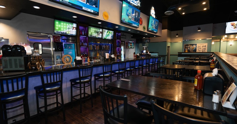 Interior, seating area with a bar in the back