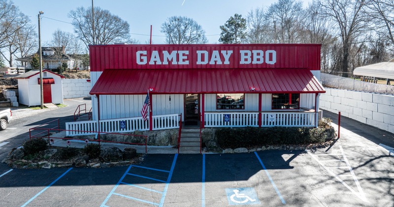 Exterior, aerial view to front of restaurant and parking lot
