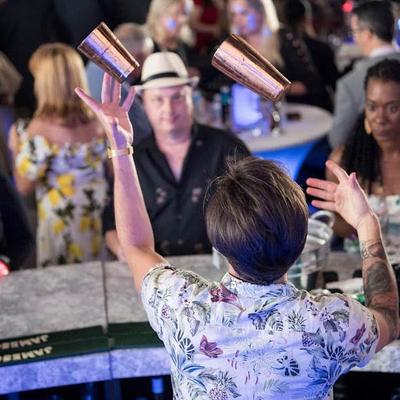 Flair bartending with cocktail shaker.