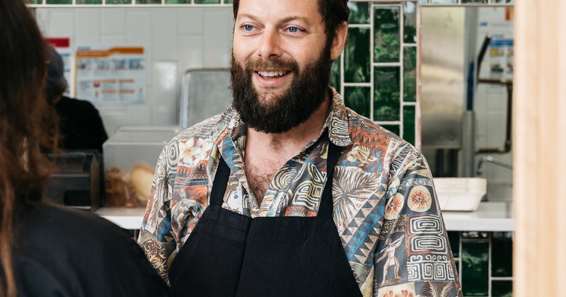 An employee interacting with a patron