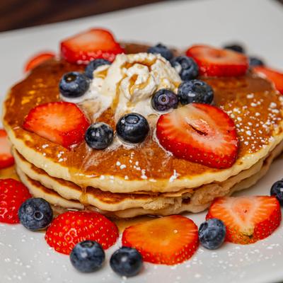 Pancakes with fresh berries, close up.