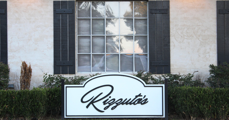 Restaurant sign on lawn