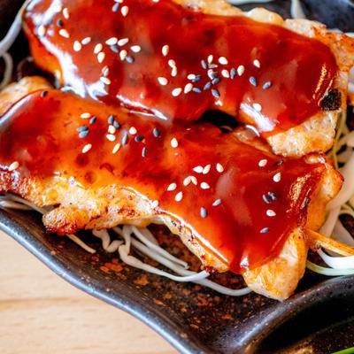 Yakitori Chicken glazed with teriyaki sauce and topped with sesame seeds.