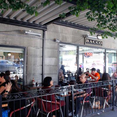 Covered patio with signage and guests.