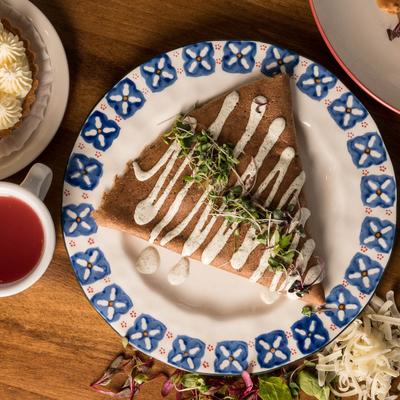 Crepe with bacon, turkey, and pesto.