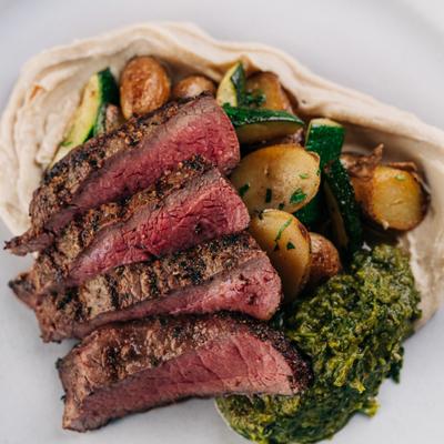 Flat Iron Steak with White Bean Hummus, Zoug, Zucchini and Potatoes..