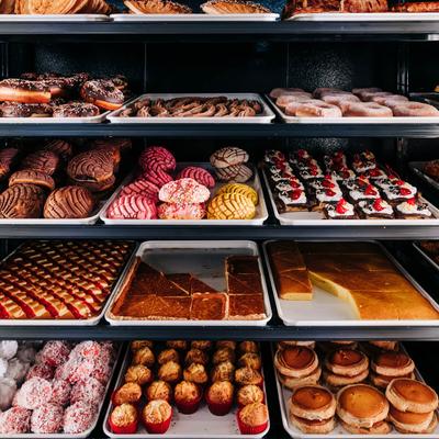 A display of assorted pastries in a bakery.
