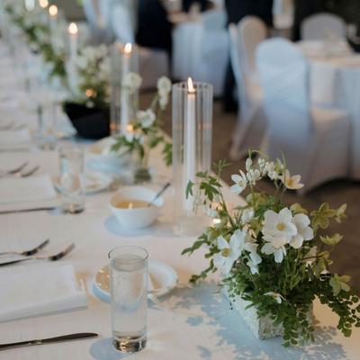 A beautifully decorated table setting for a wedding reception.