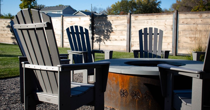 Exterior, chairs lined up around the fire pit