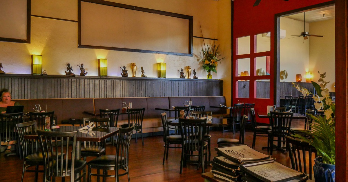 Interior, wide view, tables and chairs ready for guests
