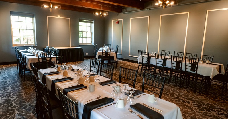 Interior, elegant dining area with grouped tables