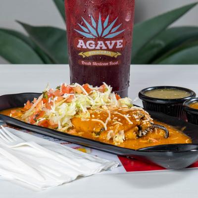 Stuffed pepper smothered in sauce.