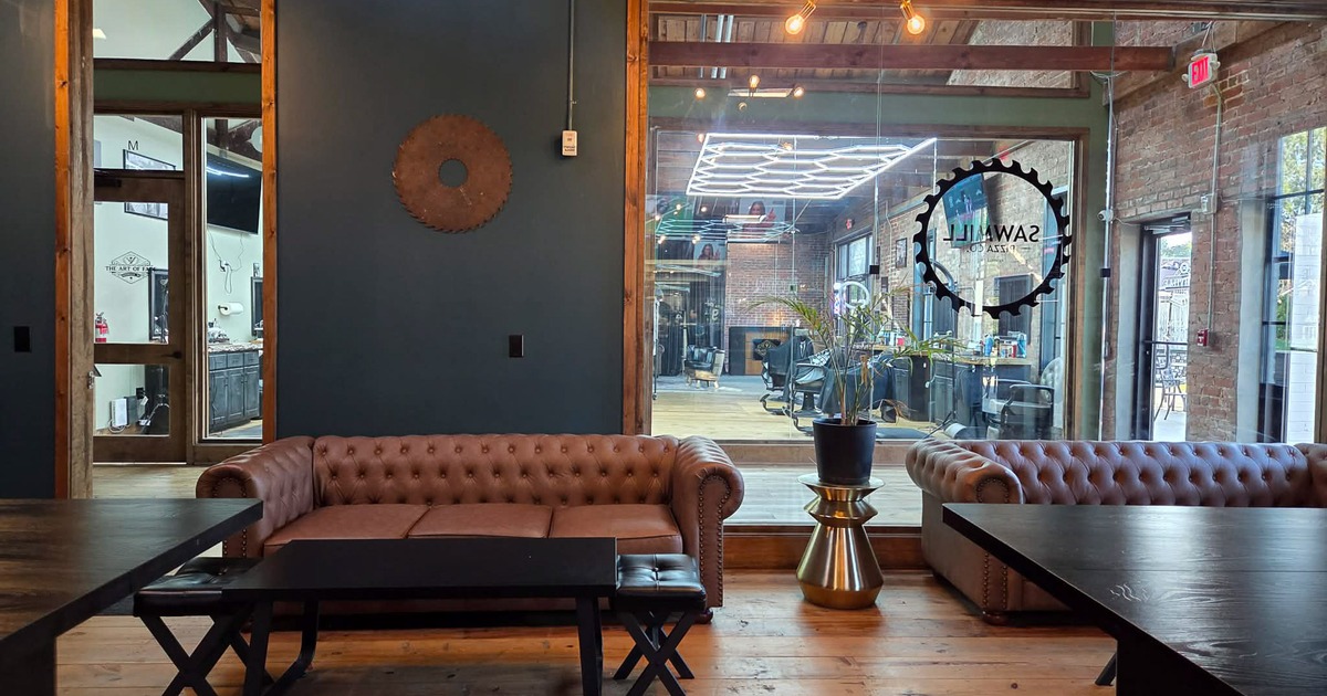 Cozy lounge area with comfortable upholstered sofas and wooden coffee tables