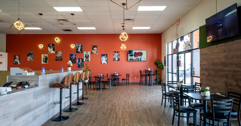 Spacious and cozy restaurant interior, seating area and bar