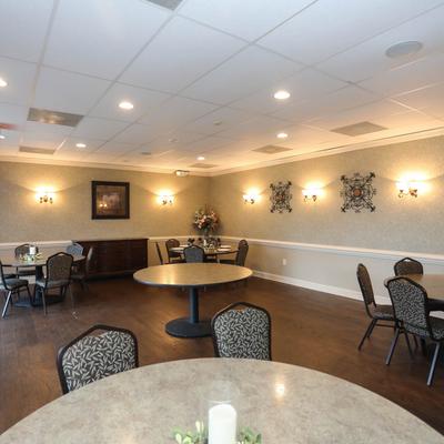 Interior, dining area, round marble tables.