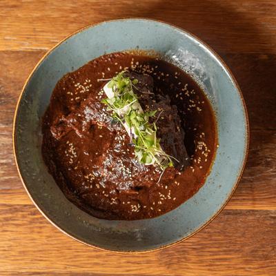 Roasted chicken, smothered in Mole sauce.