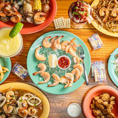 Assortment of dishes spread on a table, top view.