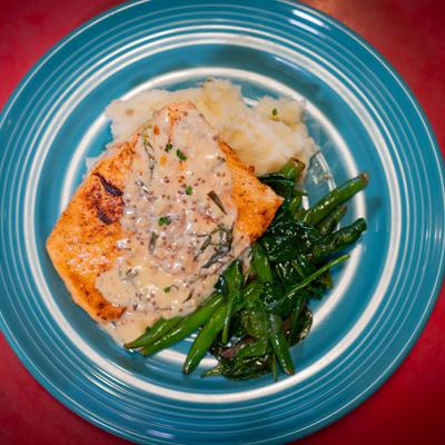 BBQ Salmon, with tarragon cream sauce, mashed potatoes, green beans, shallots, and spinach.