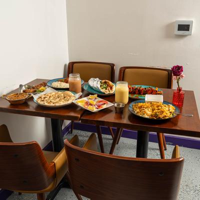 Interior, a table set with various foods and drinks.
