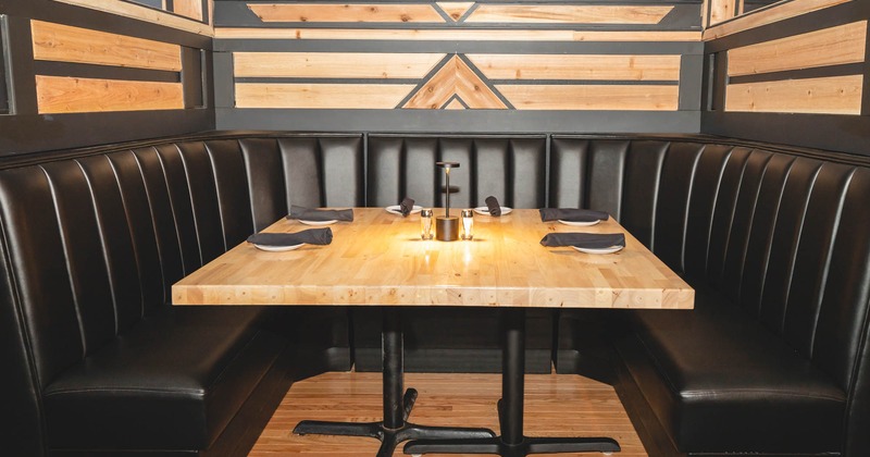 Interior, dining booth with a set table