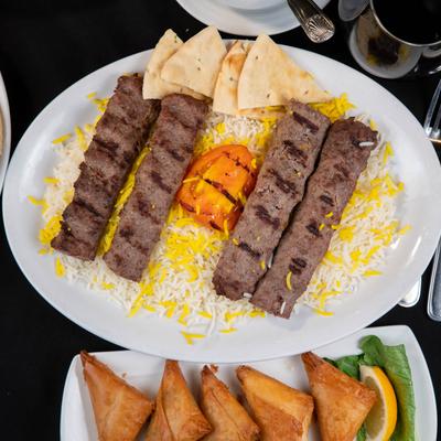 Ground beef kabobs, with rice and pita.