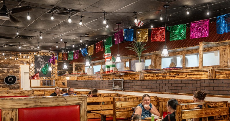 Interior, main seating area, booths with guests