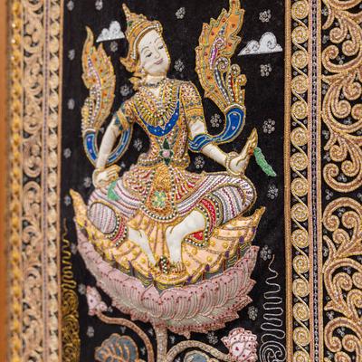 Interior decor detail, traditional embroidered wall tapestry.