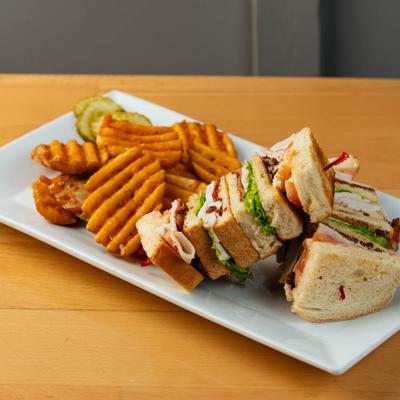 Triple Decker Club Sandwich, with waffle fries.