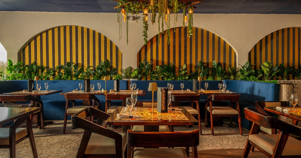 Interior, seating booths, tables, chairs, plants