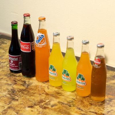 Bottles of assorted soda drinks.
