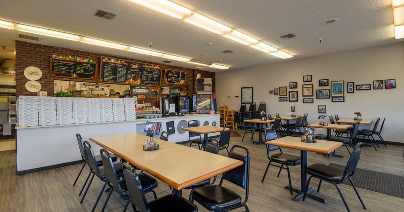 Interior, dining tables and chairs, framed pictured on the wall
