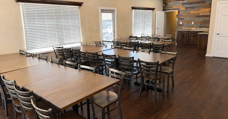 Diner area, tables and chairs, guest and staff