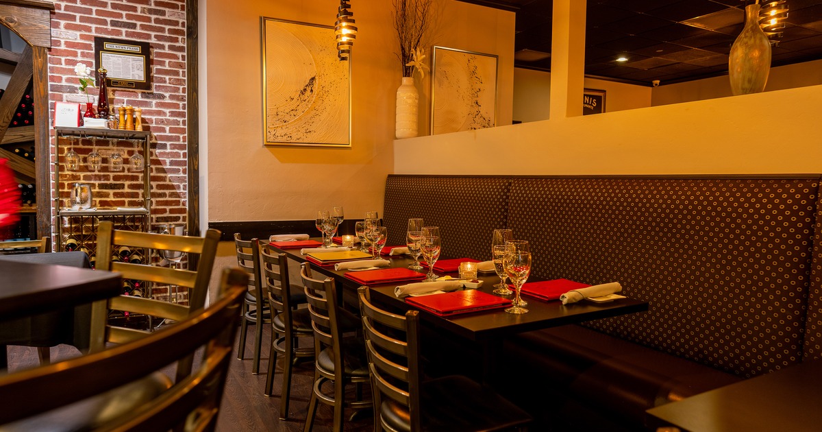 Modern and cozy interior dining area with elegantly set dining table