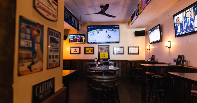 Bar interior, seating , TV on the wall