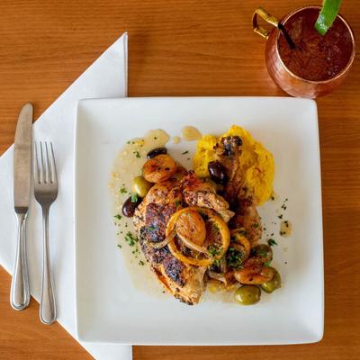 Chicken Piccata  and mule cocktail, top view.