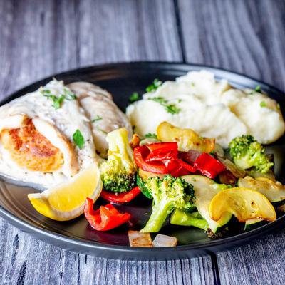 Fresh haddock with seafood stuffing, served with mashed potatoes and house vegetables.