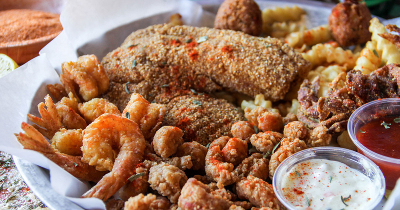 Different types of sea food, two dips